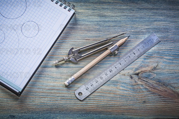 Checked copybook ruler divider pencil on vintage wood board