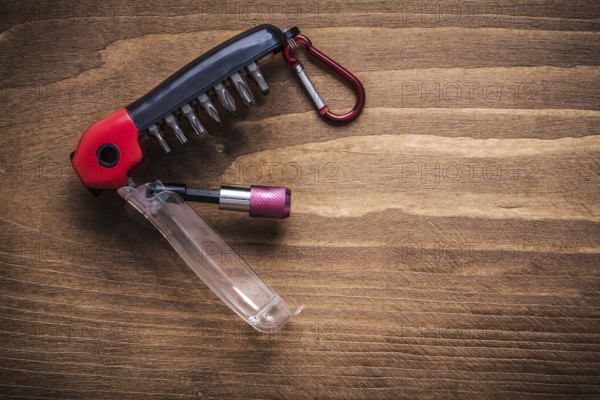 Replaceable screwdriver heads on wooden board construction concept