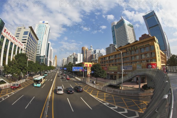 SHENZHEN - CITY IN SOUTH OF PEOPLE'S REPUBLIC OF CHINA - NOVEMBER 19, 2011: The magnificent modern city with wide prospectuses and skyscrapers. On streets cars and buses go