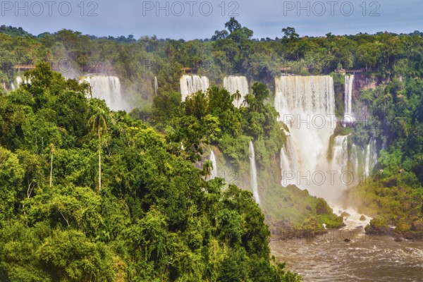 Iguazu Falls National Park - grandiose complex of waterfalls on the border of Argentina, Brazil and Paraguay. Several picturesque waterfalls. The concept of extreme and exotic tourism