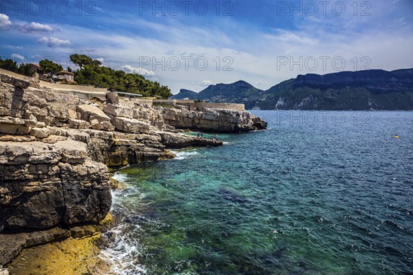 Abrupt stony coast and turquoise sea surface. Famous National Park Calanques on the Mediterranean coast