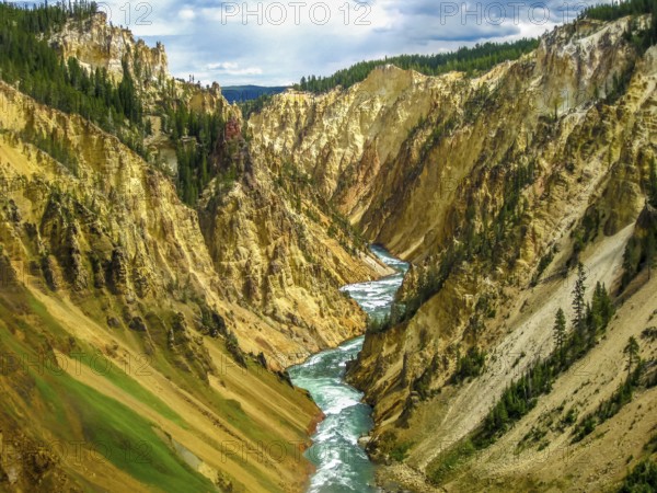 Lower Falls, most popular waterfall in Yellowstone, are located in head of the Grand Canyon in Yellowstone River. The yellow rocks gave name of Yellowstone National Park, Wyoming, United States