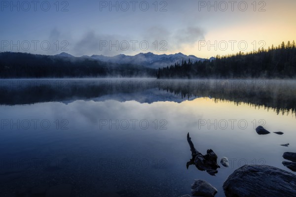 Beautiful autumn landscape scene in mountain in background in Jasper National Park west Canada with birds