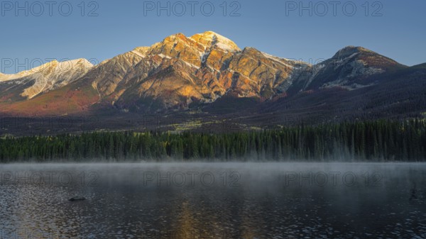Beautiful autumn landscape scene in mountain in background in Jasper National Park west Canada with birds