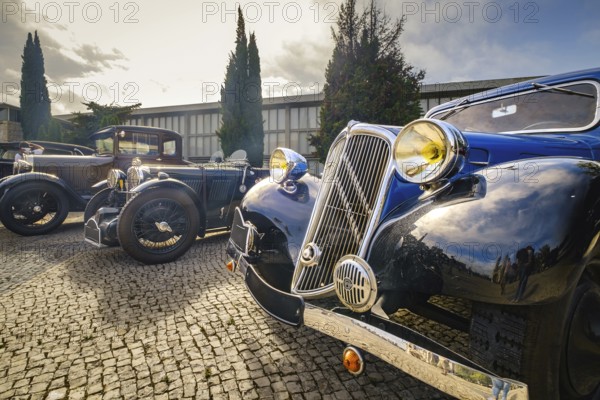 Lisbon, Portugal - Oct 15, 2023: Famous classic Citroen Traction Avant known as 7c parked on cobblestone driveway. First mass-produced monocoque-bodied and front-wheel drive car in the world, executive class, 4-door saloon, 1930s, by Citroen, France