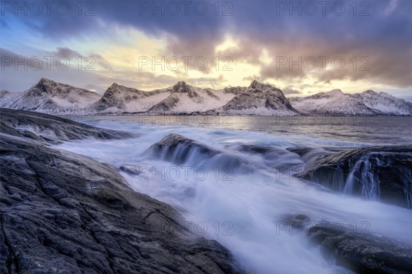 Beautiful winter landscape scene, sunset or sunrise in mountains and fjords