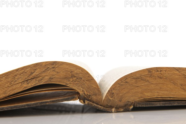 Old open book isolated over white background