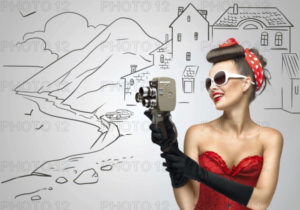 Glamorous pin up tourist girl filming a landscape with an old retro cinema 8mm camera, standing in front of a sketchy background