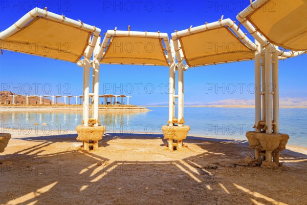 Picturesque gallery on the seashore. Coast of Israel. The drainless salt lake Dead Sea in the Middle East