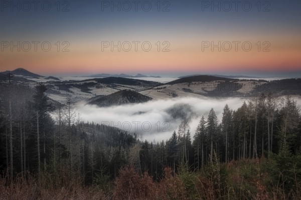 Fog over the Liptov village of Velke Borove before sunrise by Liptovska Mara in Slovakia