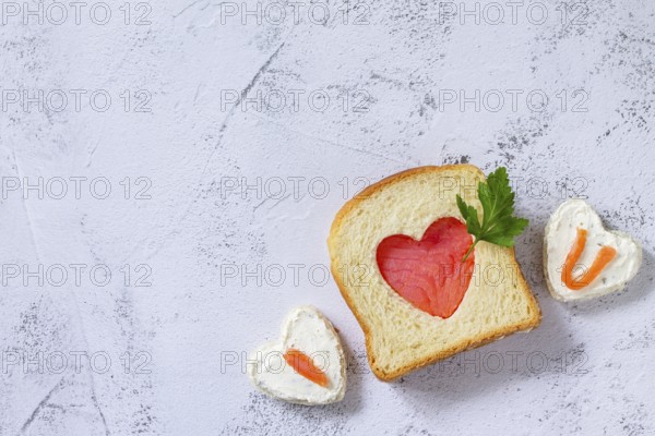 Breakfast for valentine's day or mother's day, toast with salmon and curd cheese with the inscription that I love you.Top view flat lay. Copy space