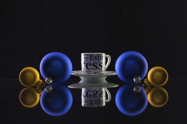 Cup of coffee and Christmas decoration on the glass table