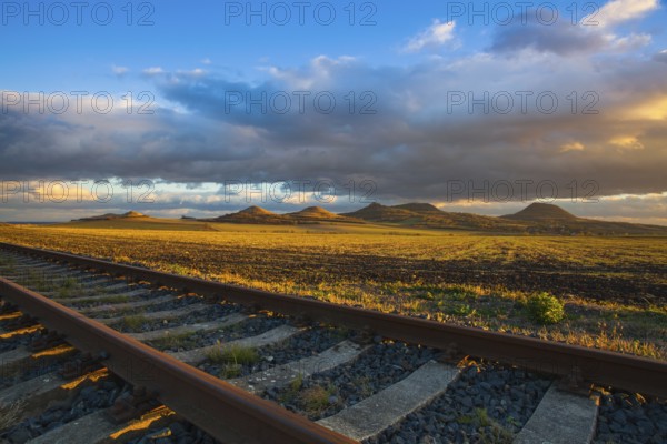 Single railway track at sunset, Central Bohemian Uplands, Czech Republic. Railway track in nature park Central Bohemian Highlands, Czech Republic