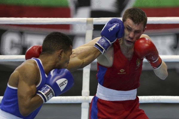 Sofia, Bulgaria. 27th February, 2021. Dorin Bucsa (red) of Moldova and Havier Ibanes of Bulgaria fight in their final round of Feather (57kg) category of the 72-nd International Boxing T ournament Strandja 2021, Sofia, Bulgaria