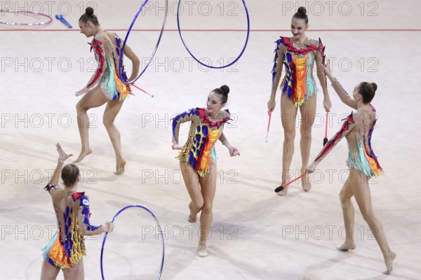 Sofia, Bulgaria - 27 March, 2021: Team Belarus perform during the 3 Hoops + 2 pairs of Clubs group qualifications at the 2021 Rhythmic Gymnastics Sofia World Cup, Sofia, Bulgaria