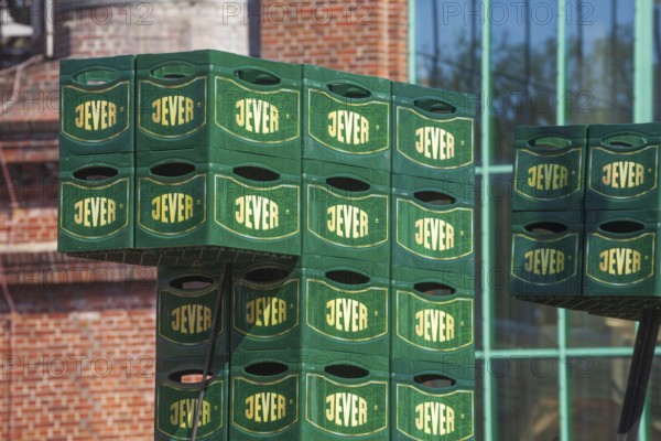 Stacked Jever beer crates in front of the Frisian Brewery, Jever Brewery, Jever, East Frisia, Lower Saxony, Germany