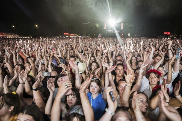 WROCLAW, POLAND - AUGUST 12, 2023: Festival Meskie Granie (Man's playing) play of audience in front of the stage