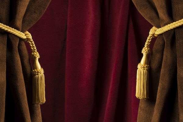 Red theatre curtains and yellow tassels