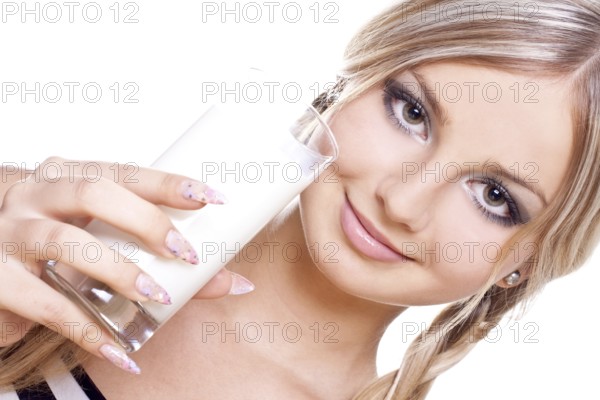 Beautiful woman drinking milk on a white background