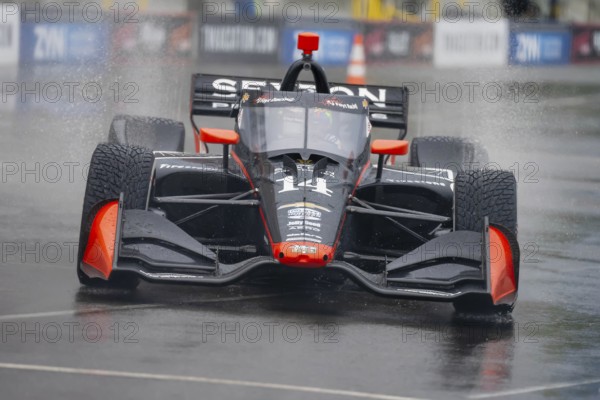 INDYCAR Series driver, SANTINO FERRUCCI (14) of Woodbury, Connecticut, travels through the turns during a wet and dangerous practice session for the Big Machine Music City Grand Prix at Streets of Nashville in Nashville TN