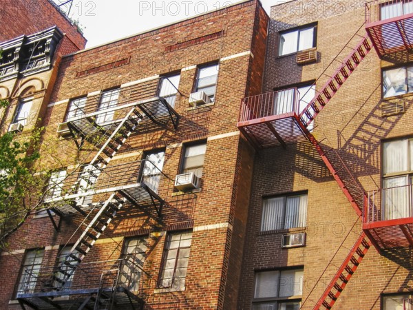 Typical building with fire escapes on the facade in New York City, United States