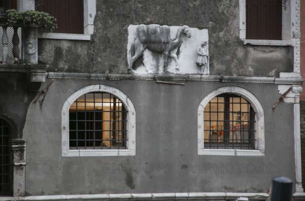 Italy Venice Palazzo Mastelli -439 early Gothic built in the 14th century above the plinth on the right relief of a camel with a guide
