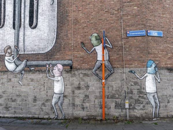 Large wall graffiti on the brick wall of buildings in Craenendonck Street, Leuven, Flemish Brabant region, Belgium