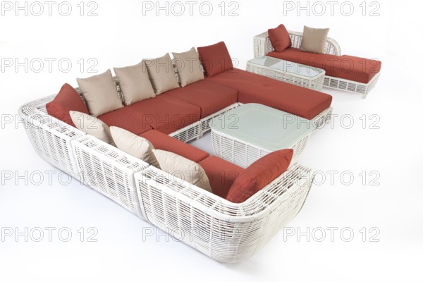 Suite of wicker furniture made of synthetic fibre on isolated background