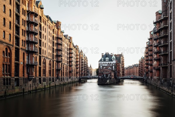 Long exposure view of the Warehouse District or Speicherstadt. Wandrahmsfleet canal. UNESCO World Heritage Site