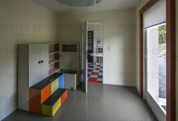 Weimar, Haus am Horn, show house built in 1923 to a design by Georg Muche, children's room furniture by Alma Buscher at the back View through to the kitchen