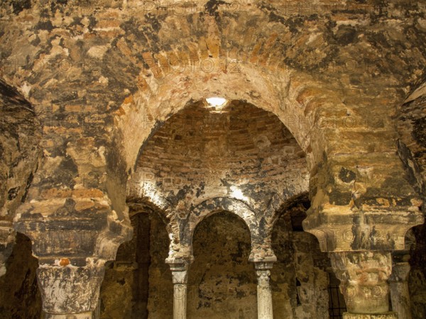 Historic interior architecture with arches and stone walls in warm light, palma de Majorca, mallorca, balearic islands, spain