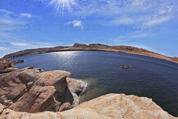 The midday sun in the turquoise water bay. Bottling magnificent Lake Powell photographed by Fisheye lens