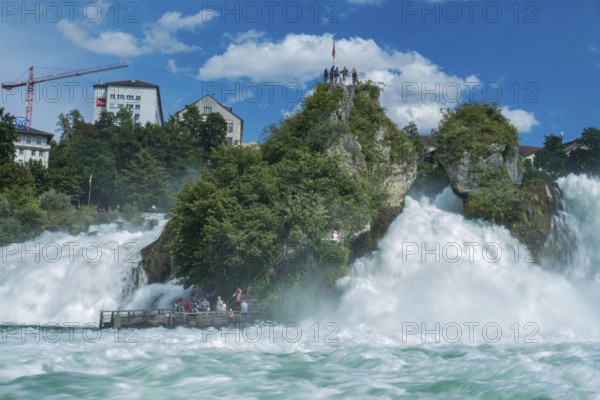 Tourist platform directly above very wild water of the Rhine waterfalls at Schaffhausen, Switzerland