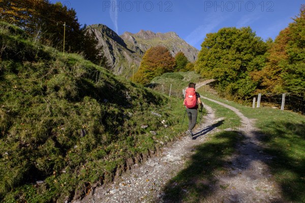 Solitary woman walking on the Arlet route, Camille path, pyrenees national park, pyrenees atlantiques, new aquitaine region, france