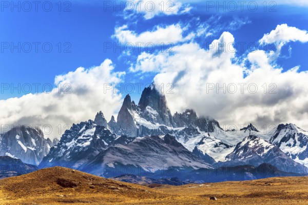 Argentine. Desert and mountains. The famous ridge Mount Fitz Roy in the clouds and the Patagonian prairie. The concept of active and extreme tourism