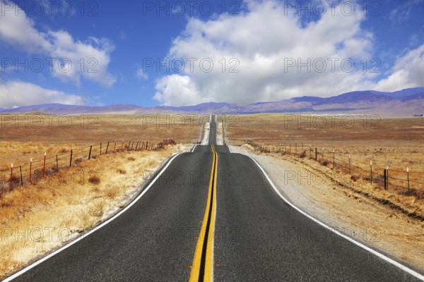 Excellent highway in California. Steppe and clouds