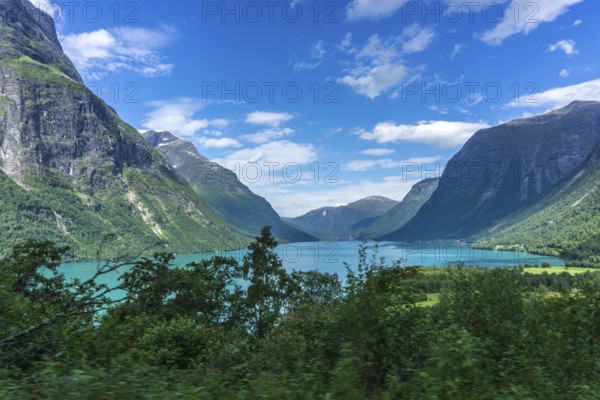 The Kjenndalsbreen is part of the Jostedalsbreen, one of the largest glaciers in Norway, and forms an impressive mountain landscape with a beautiful lake in Sande. The glacier Kjenndalsbreen with a lake in Norway is a beautiful place to travel to in summertime