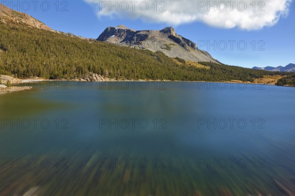 A deep blue lake on a high mountain pass