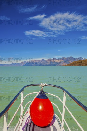 Unique lake Viedma in Argentine Patagonia. The lake is surrounded by mountains. Big boat for tourists
