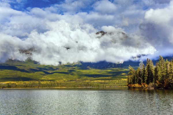 The lake is covered with light water ripples. Pyramid Lake. Cold sunny day in the Rocky Mountains of Canada