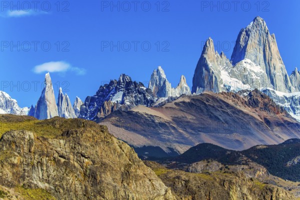Picturesque mountain range, illuminated by the midday sun. Fitzroi - mountain peak in Patagonia in the border area between Argentina and Chile. The concept of extreme, active and photo tourism