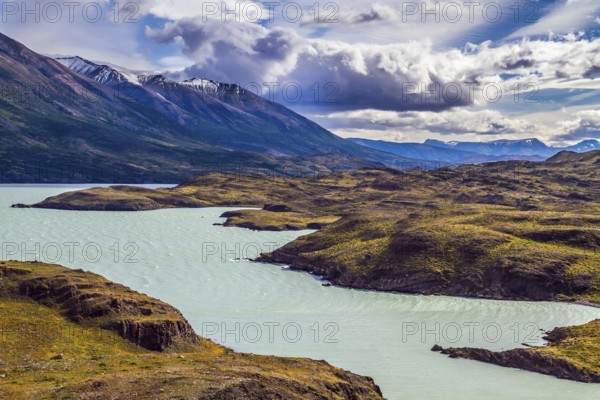 Azure lake Pehoe between rocks Los Kuernos. National Park Torres del Paine. Travel in Chile. The concept of active and extreme tourism