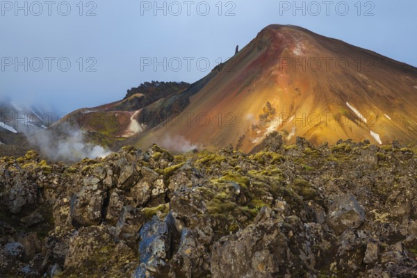 Magic sunrise in the National Park Landmannalaugar, Iceland. Mountains and hardened lava lit the hot morning sun