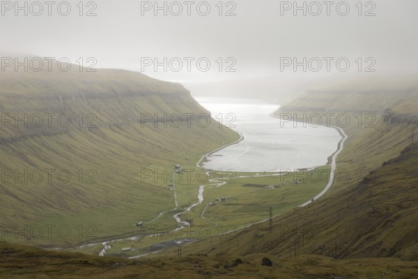 View towards Kollafjordur bay on the Faroe Islands as seen from the surrounding mountain, Faroe Islands, Denmark