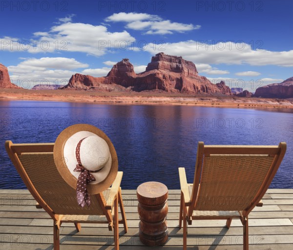 Walk to the tourist boat on Lake Powell on the Colorado River. At the stern of the vessel are two deck chairs. On the back of one hanging elegant ladies straw hat