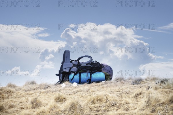 Big backpack in winter in mountains on a halt. Winter Hiking in mountains