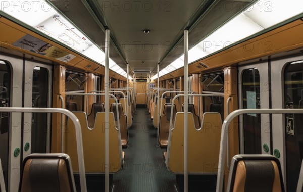 Anderlecht, Brussels Capital Region, Belgium, 03 31 2020 Almost empty orange interior of a metro carriage during the Belgian lockdown