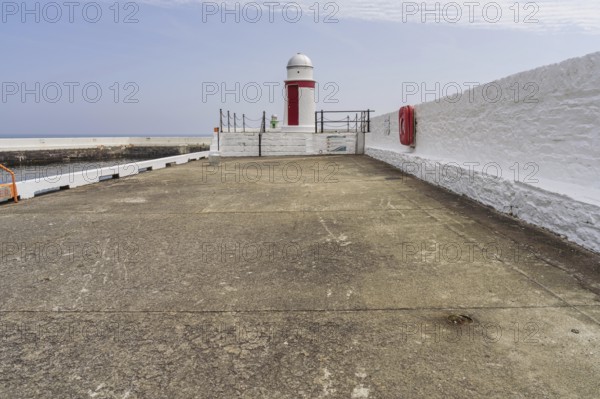 The pier and small lighthouses in Laxey, Garff, Isle of Man