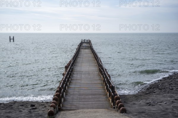 Wooden breakwater on the beach