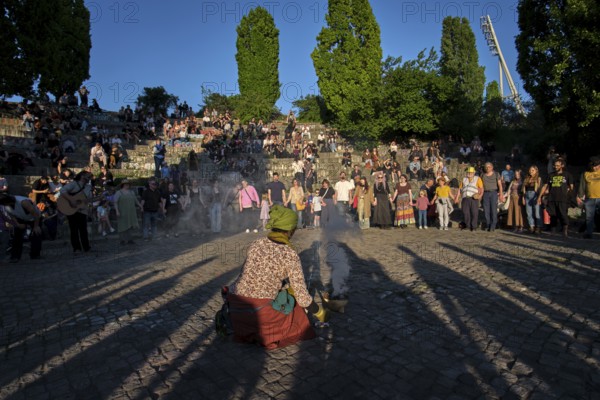 Germany, Berlin, 30.04.2025, Peaceful Walpurgis in Mauerpark, Amphitheatre, Preparation Peace Circle, Incense